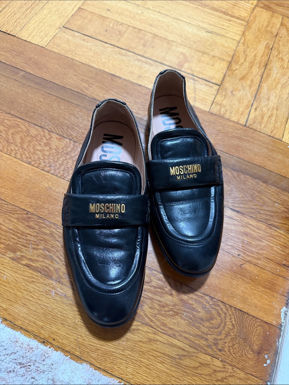 Moschino Black Leather women’s Penny Loafers with Gold Logo
